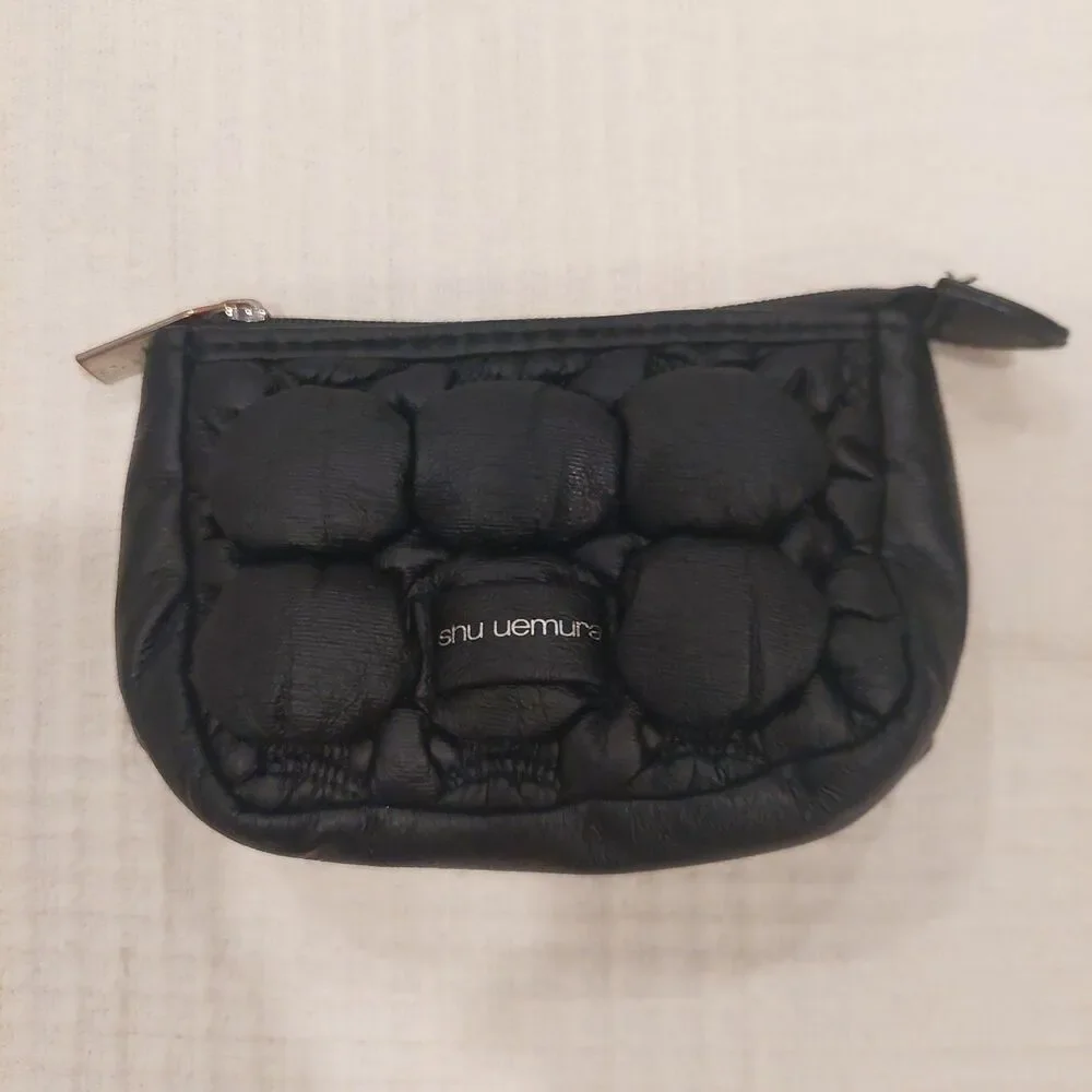 black quilted novelty cosmetic pouch from Shu Uemura